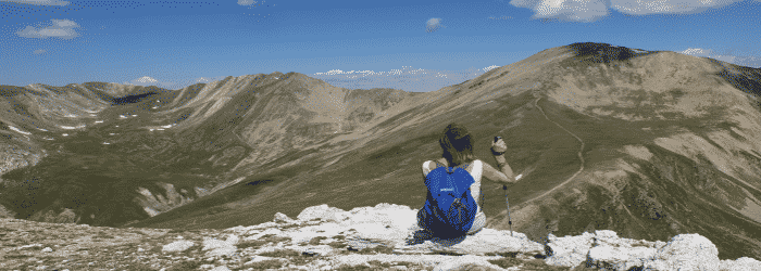hiker at top of mountain - hypnotherapy certification