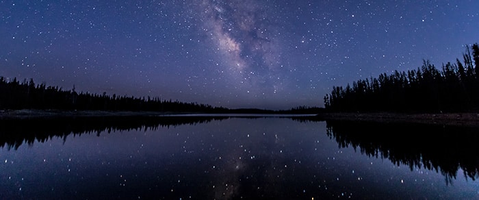 stars and galaxy reflected in lake - hypnosis for pain guide 